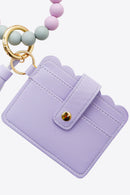 "Accessorize in Style: 2-Pack Mini Purse Tassel Key Chain by Burkesgarb"