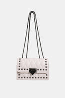 "Edgy and Chic: Studded Leather Crossbody Bag at Burkesgarb