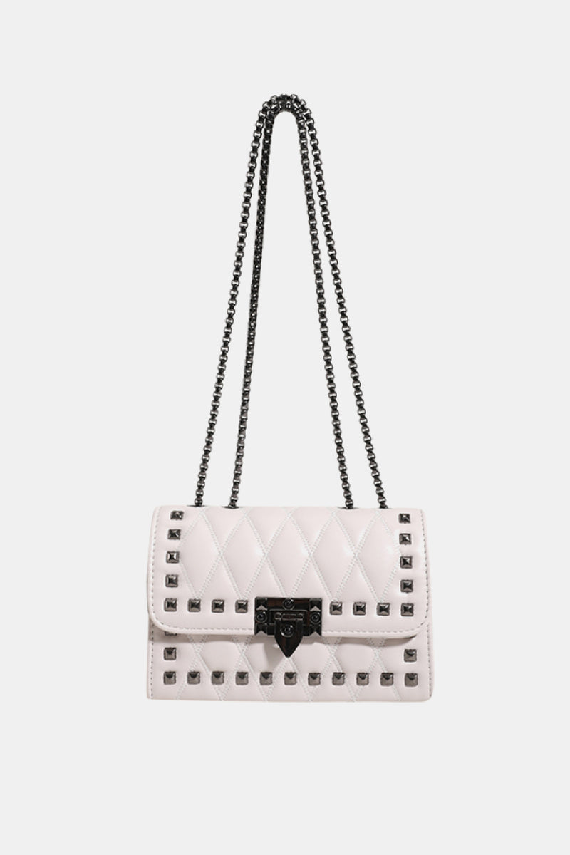 "Edgy and Chic: Studded Leather Crossbody Bag at Burkesgarb