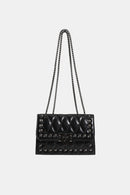 "Edgy and Chic: Studded Leather Crossbody Bag at Burkesgarb