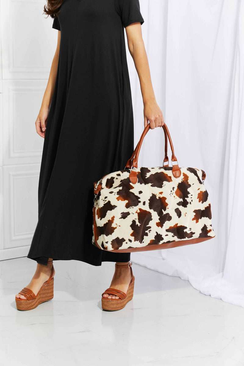 Travel in Style with the Cow Spots Plush Weekender Bag at Burkesgarb