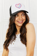 "Cool and Playful: Black Trucker Hat with Heart by Burkesgarb | Stylish and Trendy Women's Accessory"