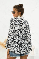 Embrace Elegance with the Flare Sleeve Tie Neck Ruffle Trim Blouse at Burkesgarb