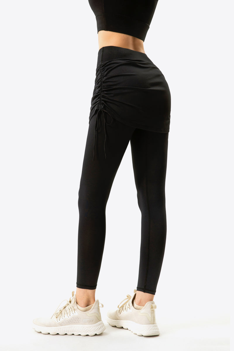 Elevate Your Wardrobe with Drawstring Ruched Faux Layered Yoga Leggings at Burkesgarb