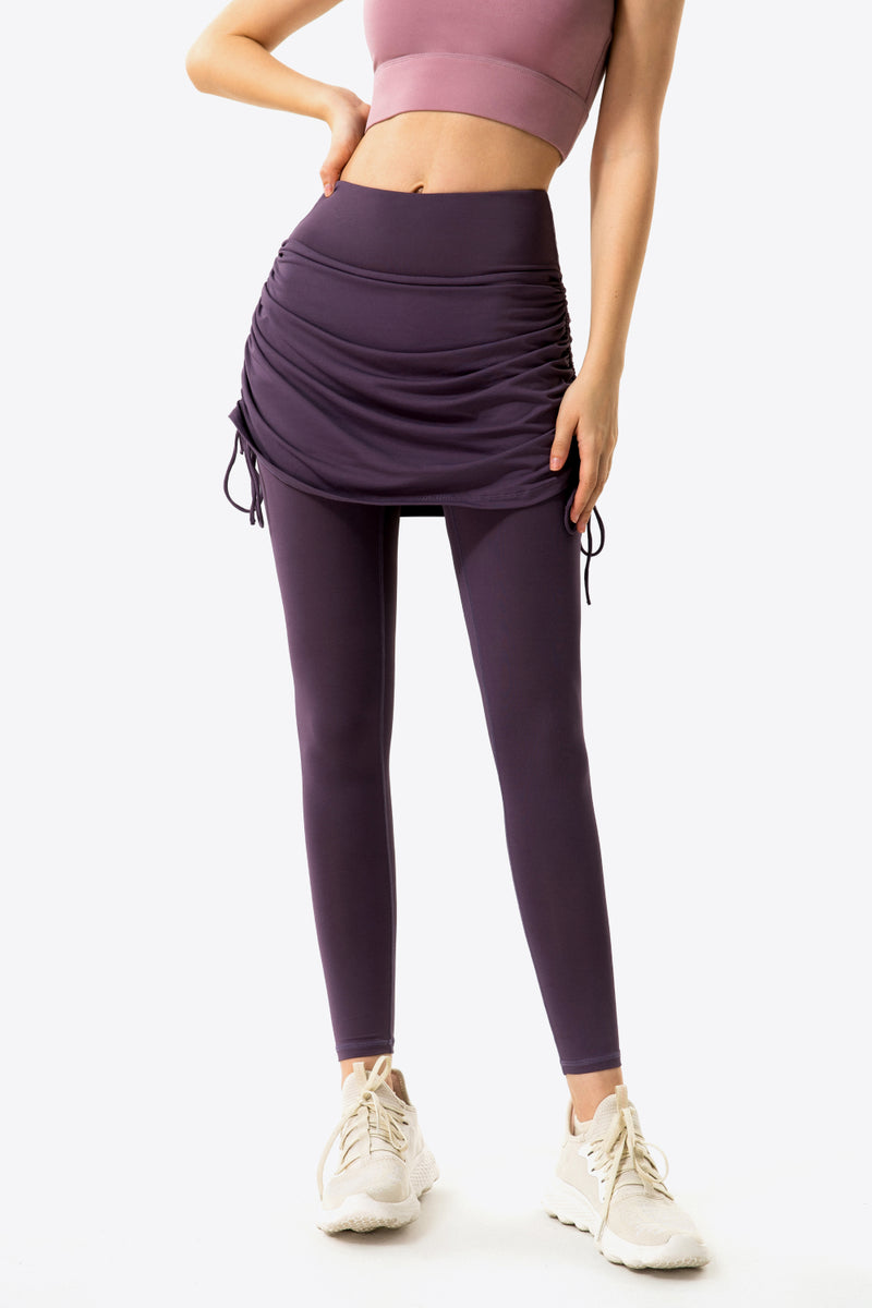 Elevate Your Wardrobe with Drawstring Ruched Faux Layered Yoga Leggings at Burkesgarb