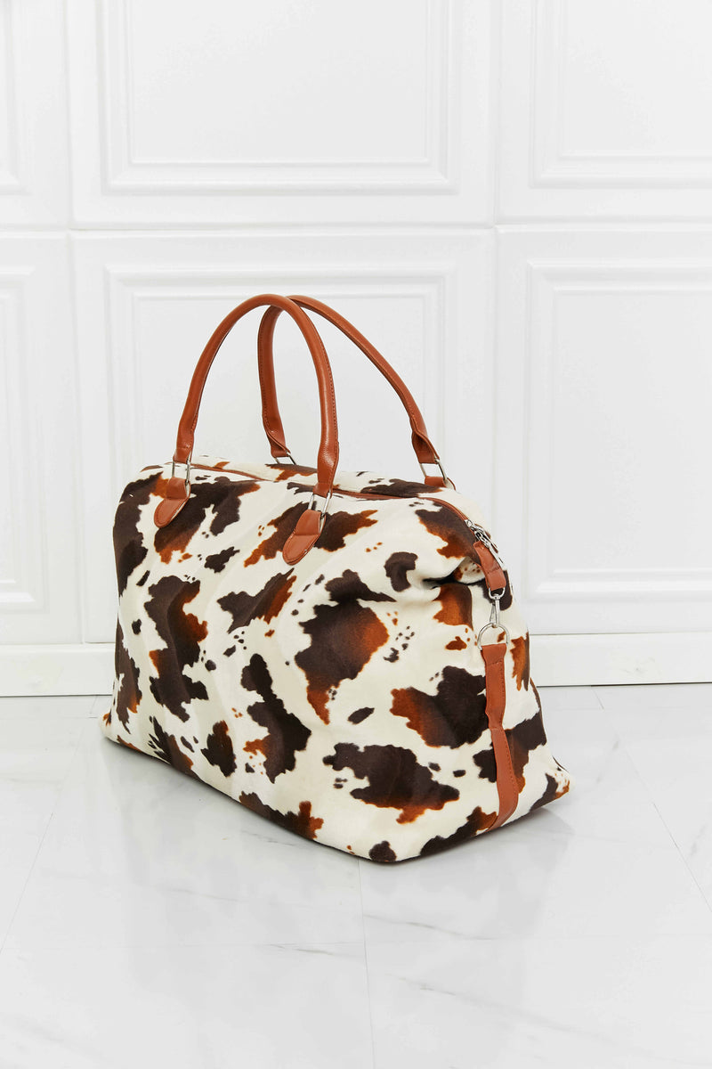 Travel in Style with the Cow Spots Plush Weekender Bag at Burkesgarb