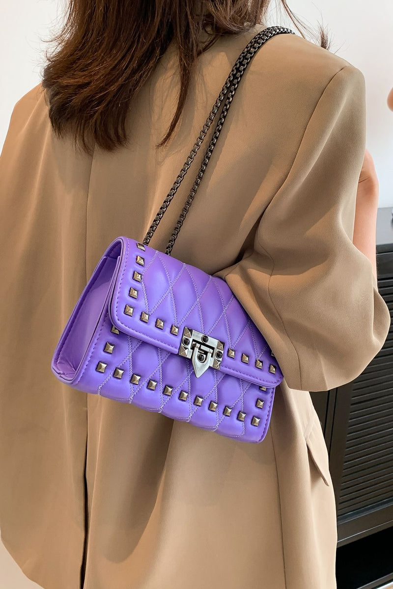 "Edgy and Chic: Studded Leather Crossbody Bag at Burkesgarb