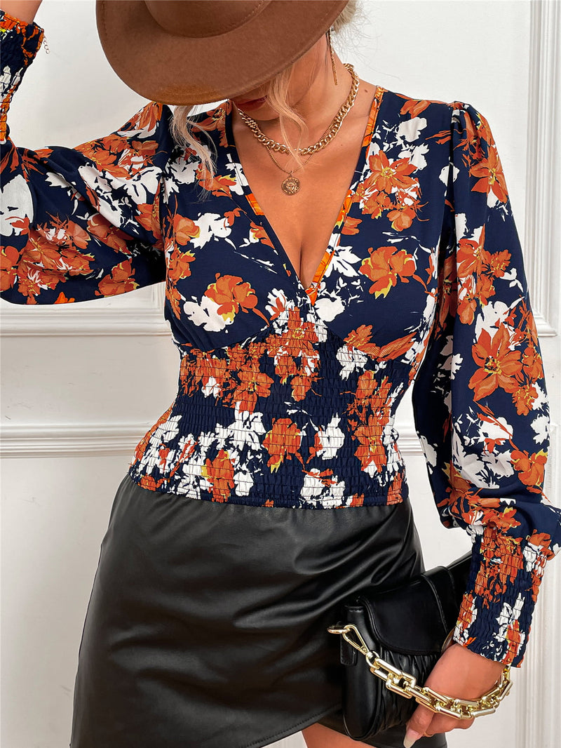 Chic and Feminine: Smocked Floral Lantern Sleeve Blouse at Burkesgarb