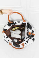 Travel in Style with the Cow Spots Plush Weekender Bag at Burkesgarb