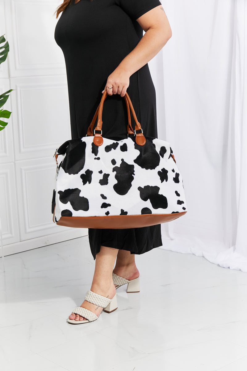 Travel in Style with the Cow Spots Plush Weekender Bag at Burkesgarb