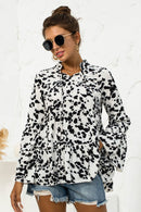 Embrace Elegance with the Flare Sleeve Tie Neck Ruffle Trim Blouse at Burkesgarb