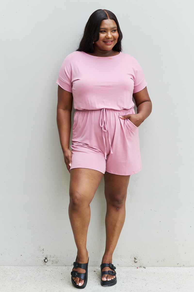 "Effortless Charm: Light Carnation Pink Short Sleeve Romper by Burkesgarb | Stylish and Comfortable Women's Outfit"