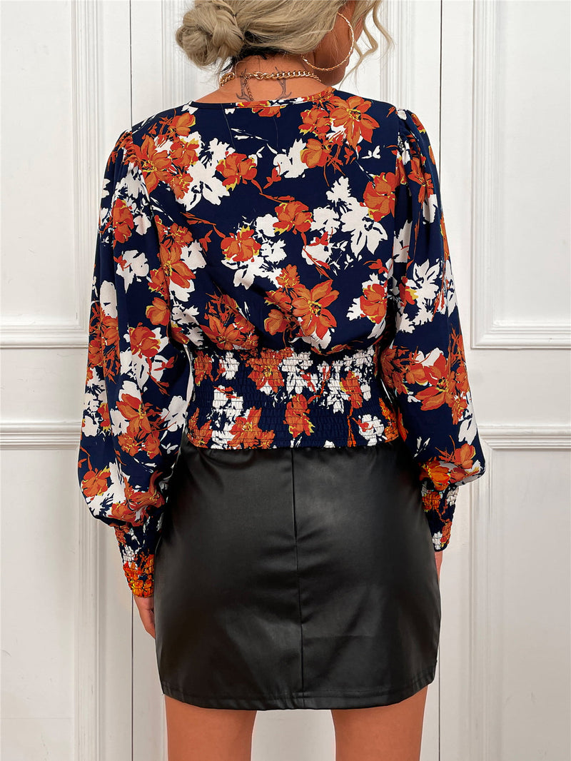 Chic and Feminine: Smocked Floral Lantern Sleeve Blouse at Burkesgarb