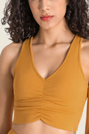 Stay Supported and Stylish with the Gathered Detail Halter Neck Sports Bra at Burkesgarb