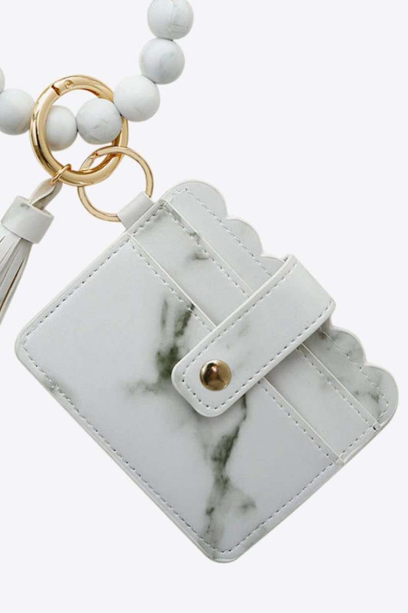 "Accessorize in Style: 2-Pack Mini Purse Tassel Key Chain by Burkesgarb"