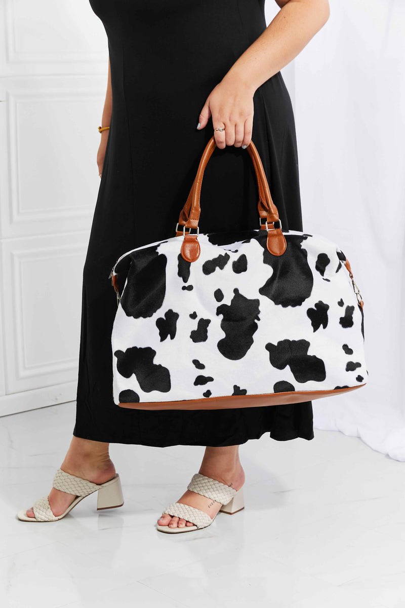 Travel in Style with the Cow Spots Plush Weekender Bag at Burkesgarb