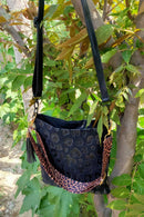 Stylish and Functional: Leather Shoulder Bag with Tassel at Burkesgarb