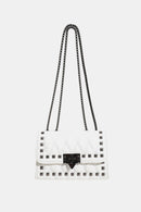 "Edgy and Chic: Studded Leather Crossbody Bag at Burkesgarb