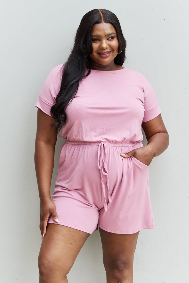 "Effortless Charm: Light Carnation Pink Short Sleeve Romper by Burkesgarb | Stylish and Comfortable Women's Outfit"