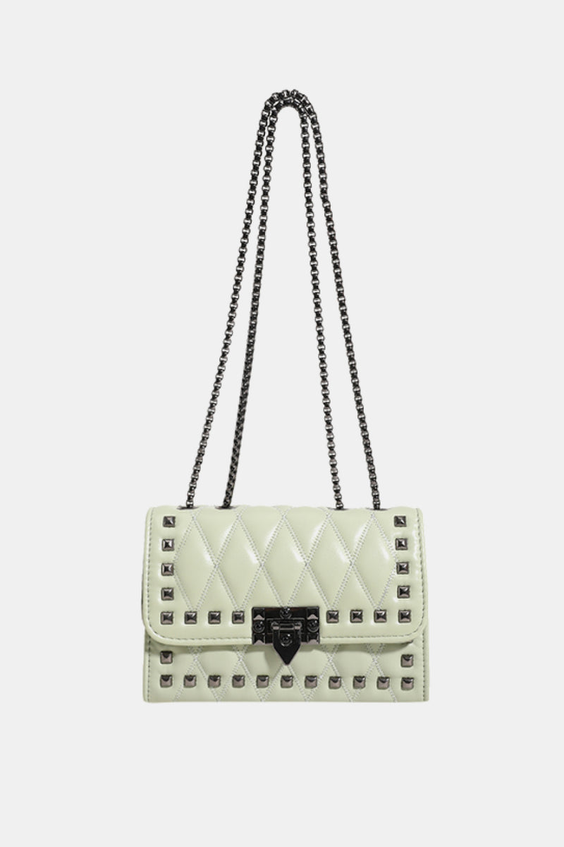 "Edgy and Chic: Studded Leather Crossbody Bag at Burkesgarb