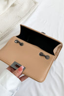 "Edgy and Chic: Studded Leather Crossbody Bag at Burkesgarb