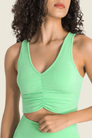Stay Supported and Stylish with the Gathered Detail Halter Neck Sports Bra at Burkesgarb