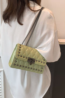 "Edgy and Chic: Studded Leather Crossbody Bag at Burkesgarb