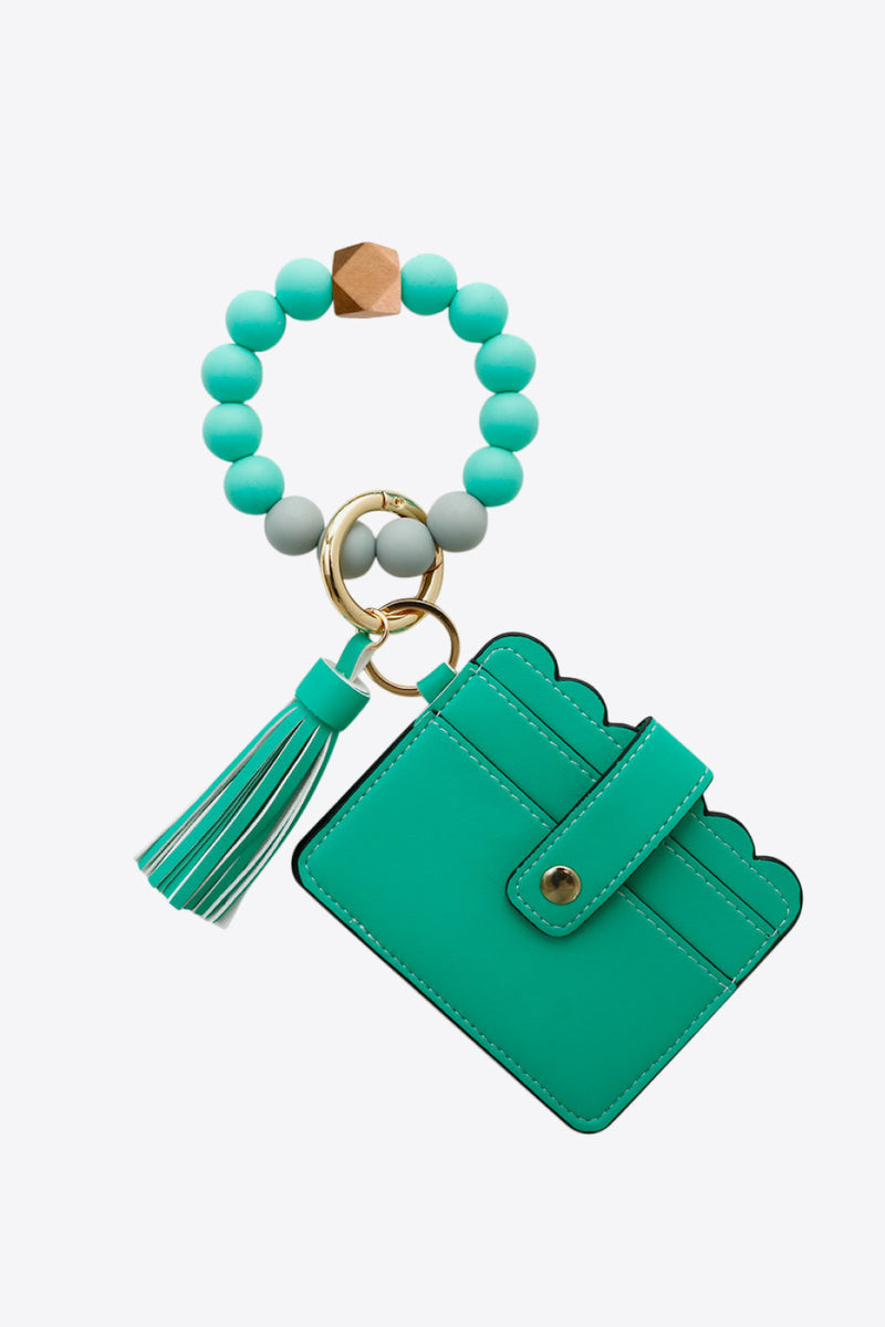 "Accessorize in Style: 2-Pack Mini Purse Tassel Key Chain by Burkesgarb"