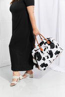 Travel in Style with the Cow Spots Plush Weekender Bag at Burkesgarb