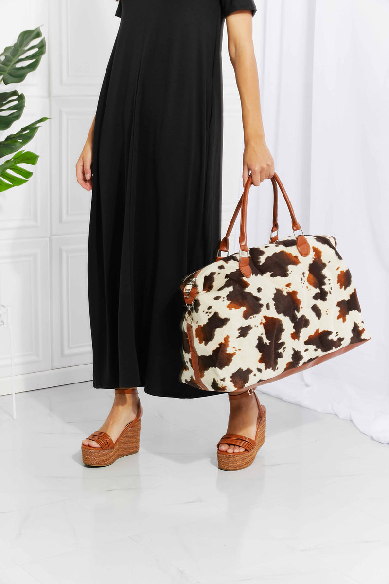 Travel in Style with the Cow Spots Plush Weekender Bag at Burkesgarb