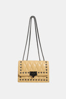 "Edgy and Chic: Studded Leather Crossbody Bag at Burkesgarb