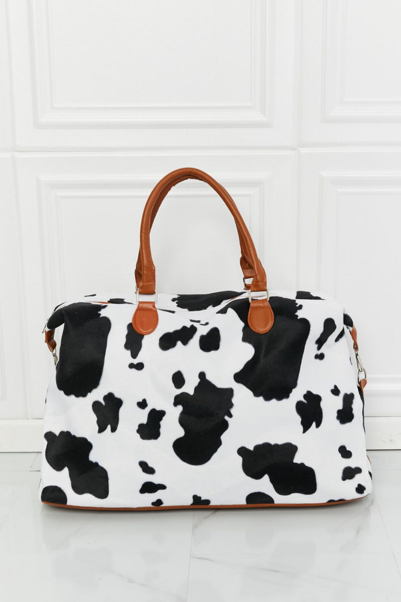 Travel in Style with the Cow Spots Plush Weekender Bag at Burkesgarb