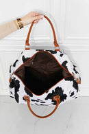Travel in Style with the Cow Spots Plush Weekender Bag at Burkesgarb