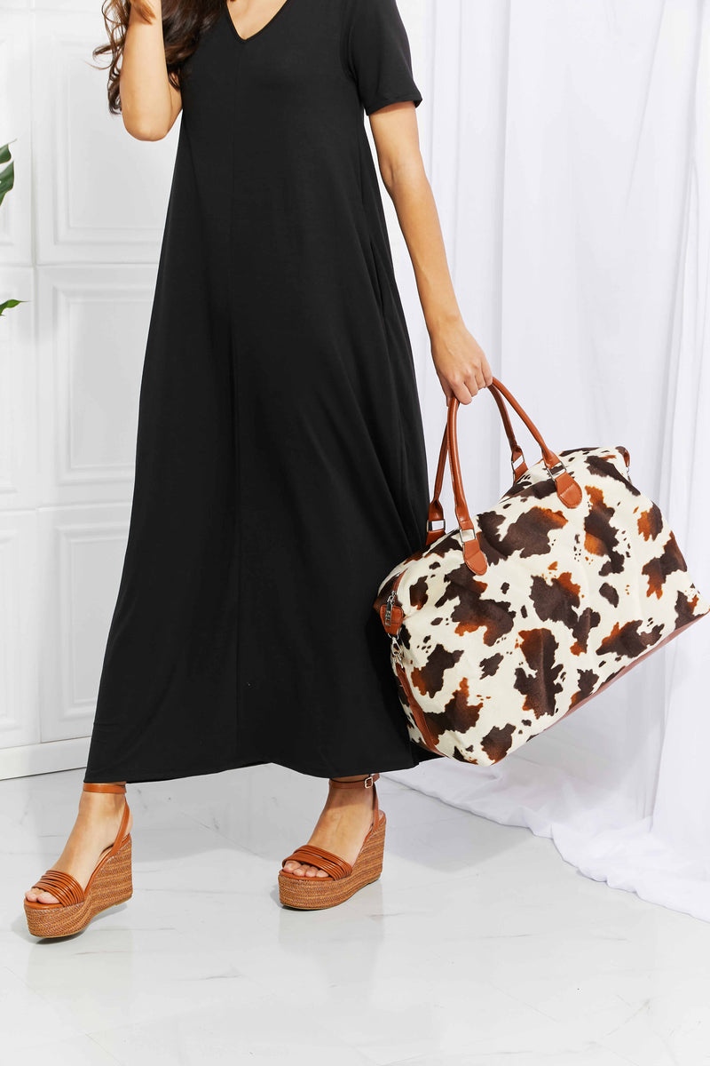 Travel in Style with the Cow Spots Plush Weekender Bag at Burkesgarb