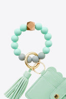 "Accessorize in Style: 2-Pack Mini Purse Tassel Key Chain by Burkesgarb"