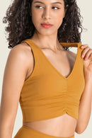 Stay Supported and Stylish with the Gathered Detail Halter Neck Sports Bra at Burkesgarb