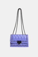 "Edgy and Chic: Studded Leather Crossbody Bag at Burkesgarb