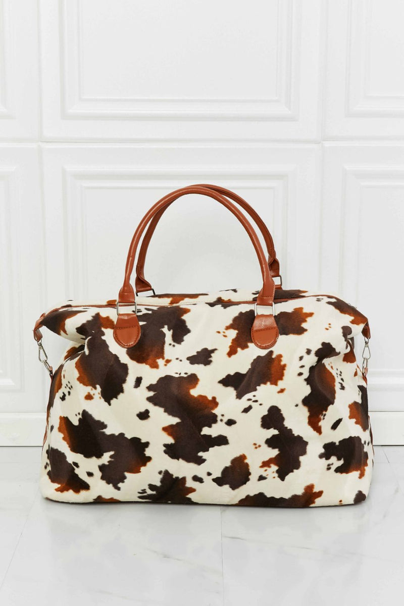 Travel in Style with the Cow Spots Plush Weekender Bag at Burkesgarb