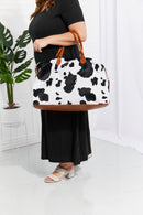 Travel in Style with the Cow Spots Plush Weekender Bag at Burkesgarb