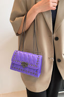 "Edgy and Chic: Studded Leather Crossbody Bag at Burkesgarb