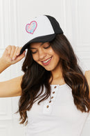 "Cool and Playful: Black Trucker Hat with Heart by Burkesgarb | Stylish and Trendy Women's Accessory"